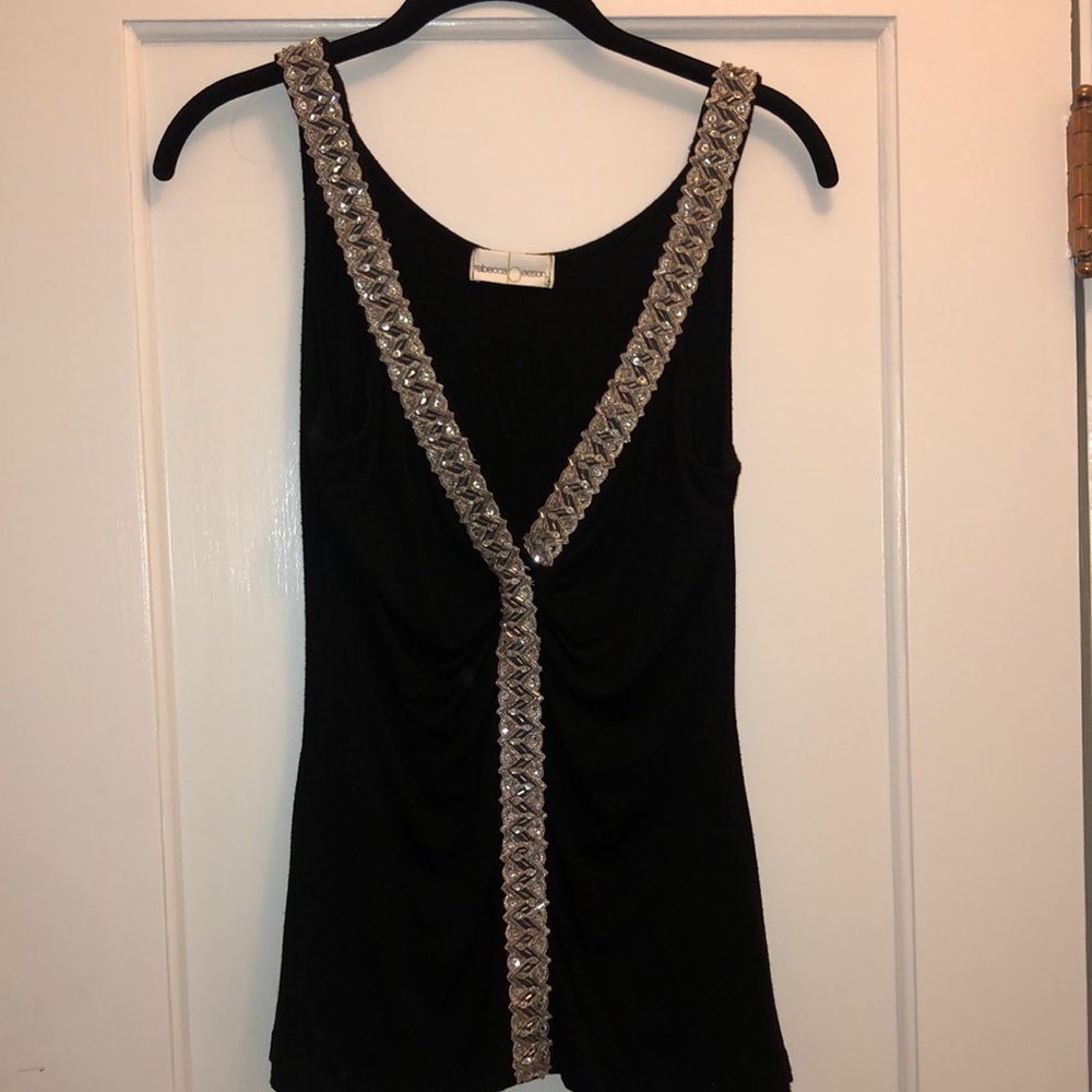 Dressy sleeveless too with beaded trim at neck slime fit